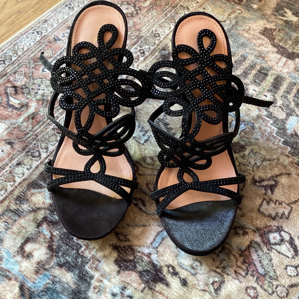 Embellished black strappy Bebe heels. They have been worn one time only.